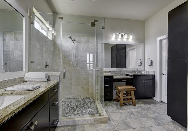 8200 SW Pkwy Unit 721, Austin, TX 78735 - bathroom featuring two vanities and a stall shower