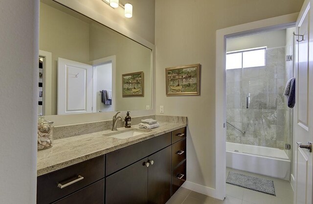 8200 SW Pkwy Unit 721, Austin, TX 78735 - bathroom with vanity, tile patterned floors, baseboards, and shower / tub combination