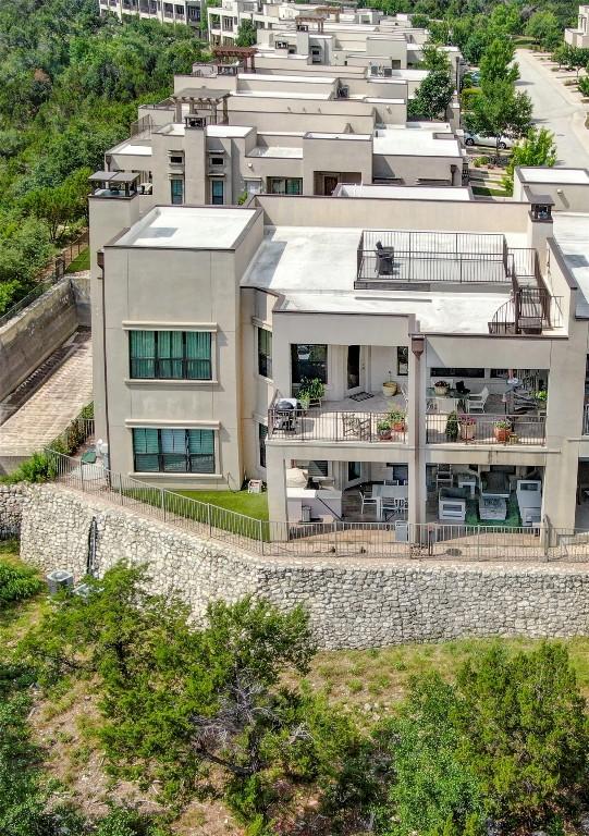 8200 SW Pkwy Unit 721, Austin, TX 78735 - rear view of property featuring a balcony and stucco siding