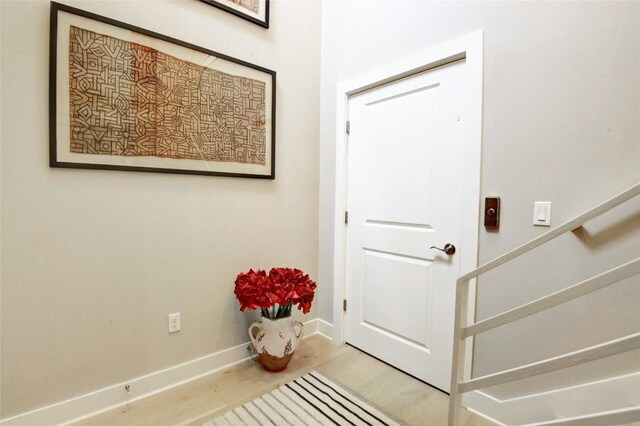 8200 SW Pkwy Unit 721, Austin, TX 78735 - foyer with wood finished floors, baseboards, and stairs