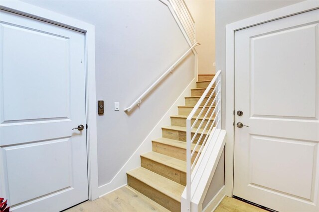 8200 SW Pkwy Unit 721, Austin, TX 78735 - staircase with wood finished floors and baseboards