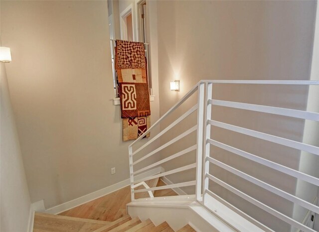 8200 SW Pkwy Unit 721, Austin, TX 78735 - staircase with wood finished floors and baseboards