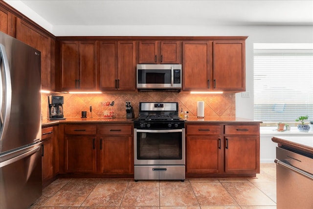 141 Wildcat Draw Dr, Buda, TX 78610 - kitchen featuring stainless steel appliances and tasteful backsplash
