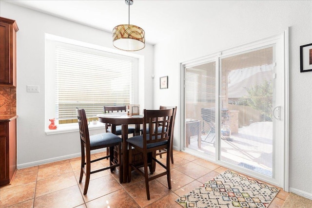 141 Wildcat Draw Dr, Buda, TX 78610 - dining area with baseboards and light tile patterned flooring