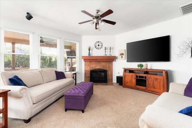141 Wildcat Draw Dr, Buda, TX 78610 - living area with ceiling fan, light colored carpet, and a tiled fireplace