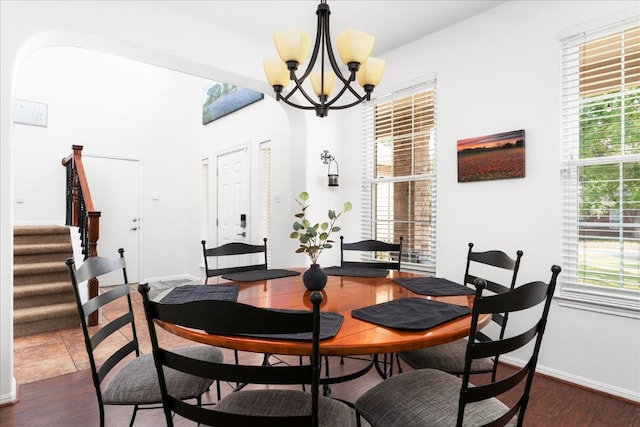 141 Wildcat Draw Dr, Buda, TX 78610 - dining area with stairway, a chandelier, dark wood-style floors, and baseboards