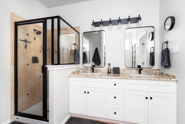 141 Wildcat Draw Dr, Buda, TX 78610 - bathroom featuring a stall shower and double vanity