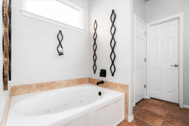 141 Wildcat Draw Dr, Buda, TX 78610 - bathroom featuring a tub with jets