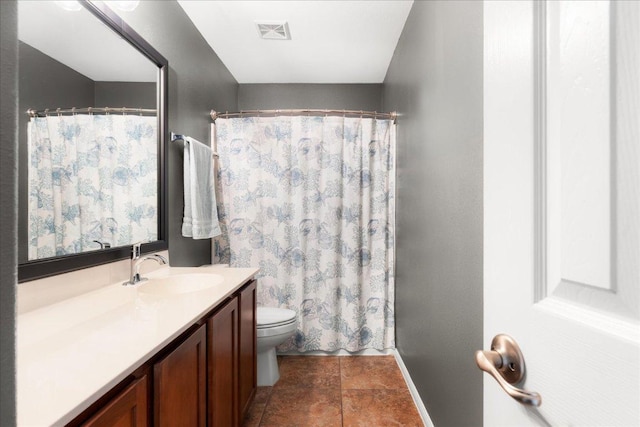 141 Wildcat Draw Dr, Buda, TX 78610 - bathroom featuring vanity, toilet, baseboards, curtained shower, and tile patterned flooring