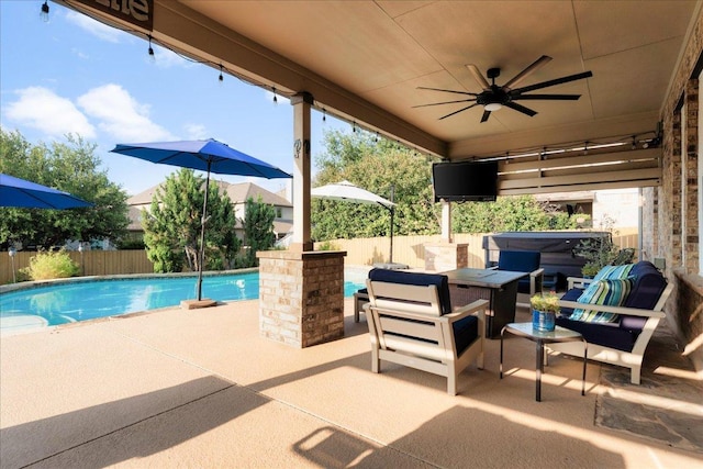 141 Wildcat Draw Dr, Buda, TX 78610 - fenced backyard featuring a jacuzzi, a patio area, and ceiling fan