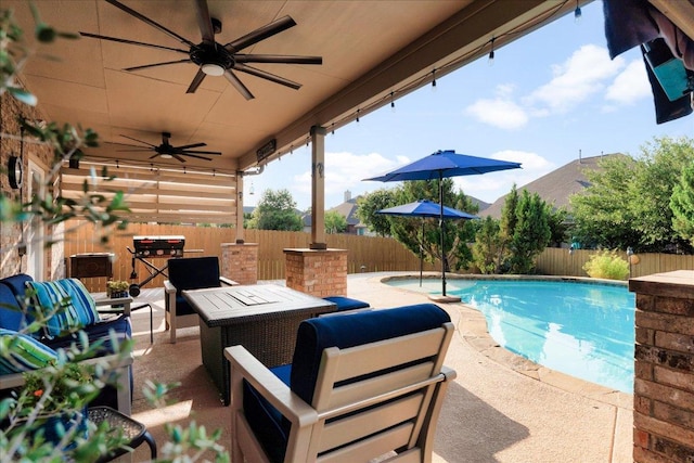 141 Wildcat Draw Dr, Buda, TX 78610 - fenced backyard featuring a ceiling fan, a patio area, and outdoor dining space