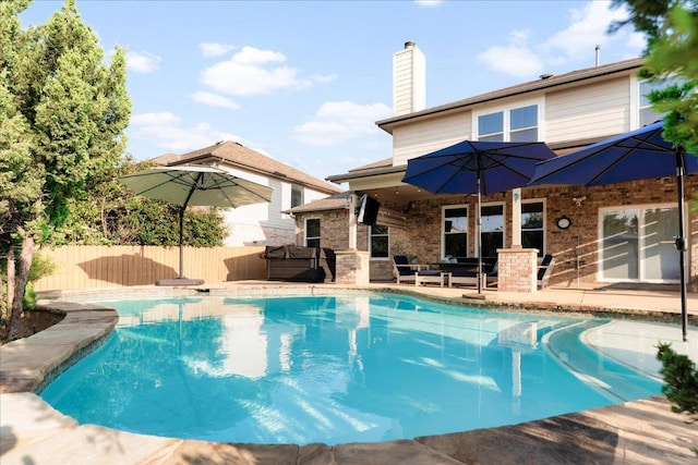 141 Wildcat Draw Dr, Buda, TX 78610 - view of swimming pool with a patio and a hot tub
