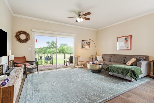 131 Nolan Dr, Georgetown, TX 78633 - living room featuring wood finished floors, ornamental molding, and a ceiling fan