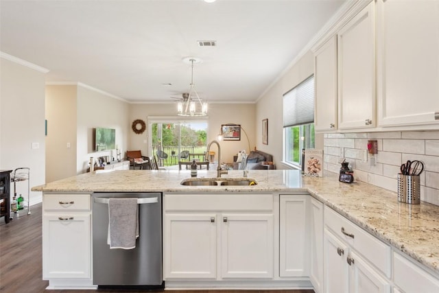131 Nolan Dr, Georgetown, TX 78633 - kitchen featuring a sink, dishwasher, a peninsula, white cabinetry, and plenty of natural light