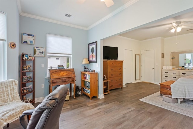 131 Nolan Dr, Georgetown, TX 78633 - bedroom with wood finished floors, ornamental molding, a ceiling fan, and baseboards