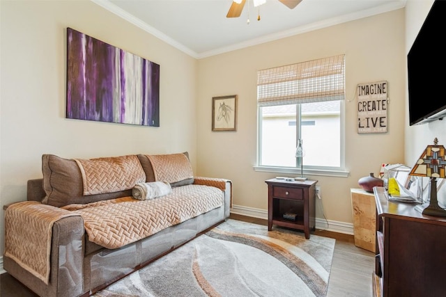 131 Nolan Dr, Georgetown, TX 78633 - living room with a ceiling fan, ornamental molding, light wood-style floors, and baseboards