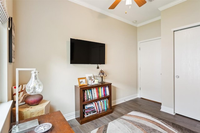 131 Nolan Dr, Georgetown, TX 78633 - bedroom with wood finished floors, crown molding, baseboards, a closet, and ceiling fan
