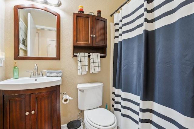 131 Nolan Dr, Georgetown, TX 78633 - full bathroom with vanity, toilet, a shower with curtain, and a textured wall