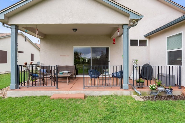 131 Nolan Dr, Georgetown, TX 78633 - back of property with stucco siding, a lawn, and a patio