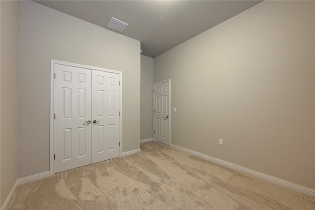 14925 Via Del Corso Dr, Austin, TX 78738 - unfurnished bedroom with light carpet, baseboards, and a closet