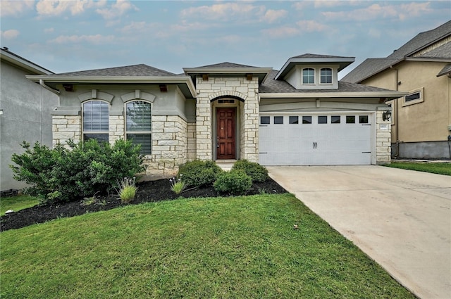 14925 Via Del Corso Dr, Austin, TX 78738 - french country style house with stone siding, concrete driveway, a front yard, an attached garage, and a shingled roof