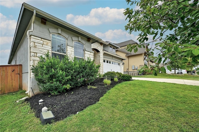 14925 Via Del Corso Dr, Austin, TX 78738 - view of front of home featuring stone siding, an attached garage, and stucco siding