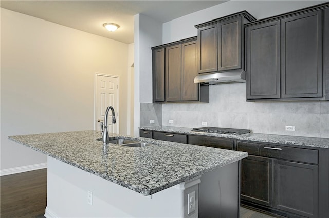 14925 Via Del Corso Dr, Austin, TX 78738 - kitchen featuring under cabinet range hood, a sink, stainless steel gas stovetop, and light stone countertops