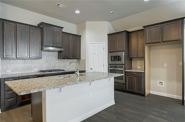 14925 Via Del Corso Dr, Austin, TX 78738 - kitchen with appliances with stainless steel finishes, a sink, baseboards, dark wood-style floors, and recessed lighting