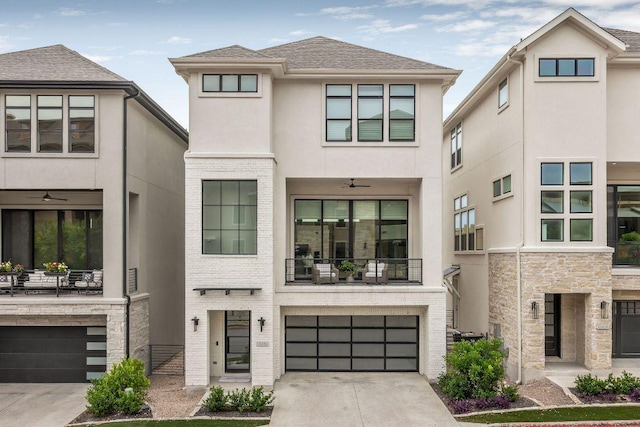 13410 Galleria Cir, Austin, TX 78738 - view of front of property featuring a garage, stucco siding, a balcony, and concrete driveway