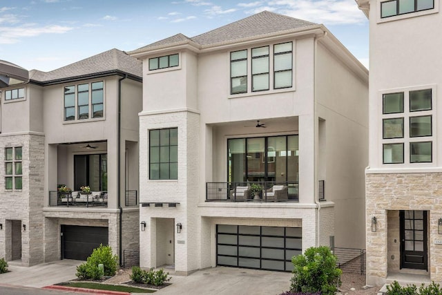 13410 Galleria Cir, Austin, TX 78738 - view of front facade featuring a garage, a balcony, and stucco siding