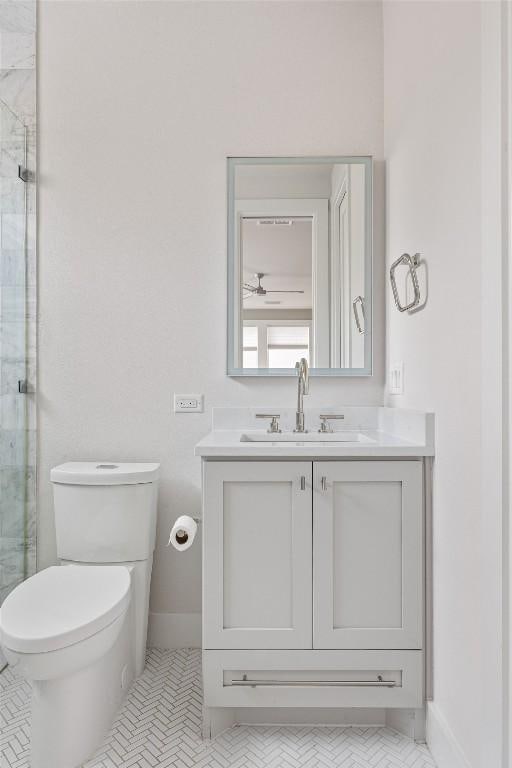 13410 Galleria Cir, Austin, TX 78738 - bathroom with vanity, a stall shower, toilet, and ceiling fan