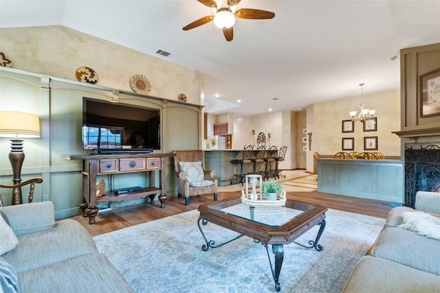 3109 Sesbania Dr, Austin, TX 78748 - living area with wood finished floors, ceiling fan, and a chandelier