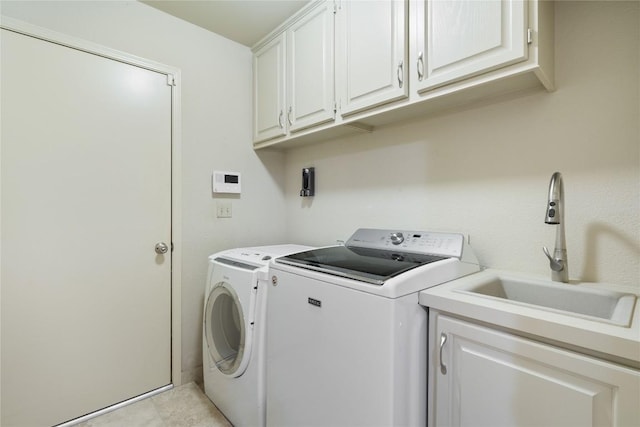 3109 Sesbania Dr, Austin, TX 78748 - laundry room featuring independent washer and dryer and cabinet space