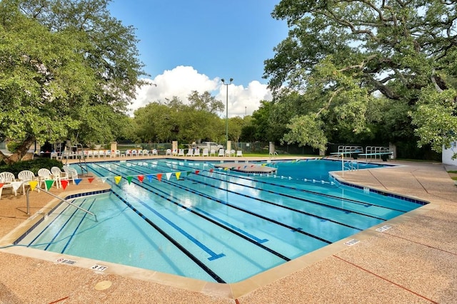 3109 Sesbania Dr, Austin, TX 78748 - community pool featuring a patio and view of wooded area