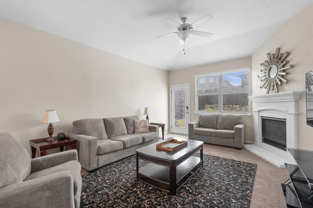 1608 Torre St, Leander, TX 78641 - living area with a glass covered fireplace, carpet floors, and a ceiling fan