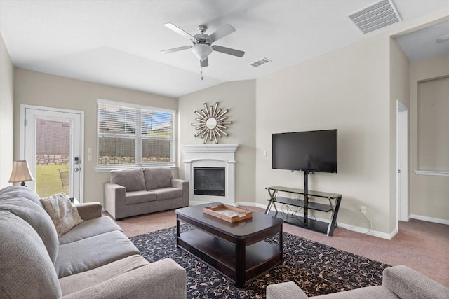 1608 Torre St, Leander, TX 78641 - living room featuring carpet floors, ceiling fan, and a glass covered fireplace