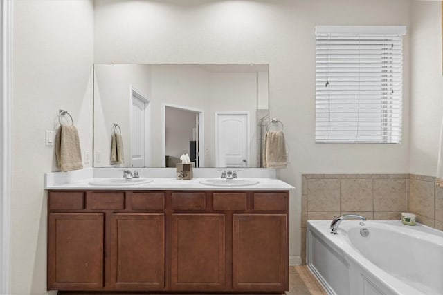 1608 Torre St, Leander, TX 78641 - bathroom featuring double vanity and a garden tub