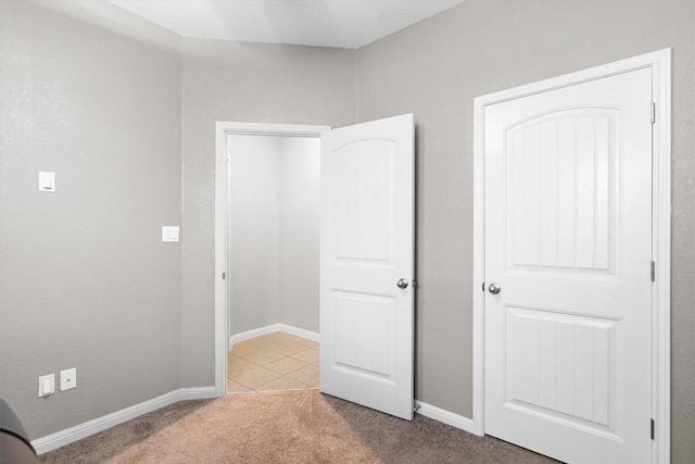 1608 Torre St, Leander, TX 78641 - unfurnished bedroom with carpet and tile patterned flooring