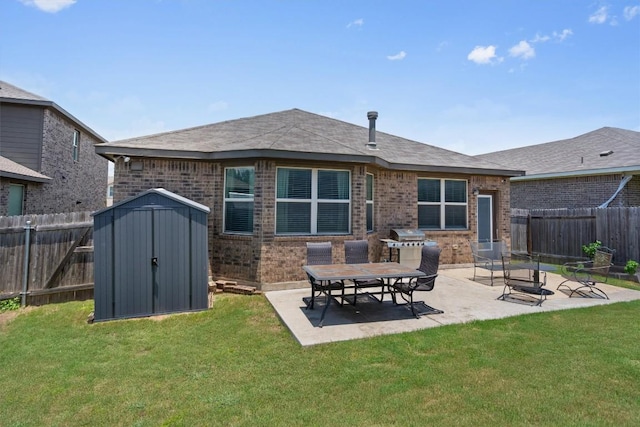 1608 Torre St, Leander, TX 78641 - back of house featuring brick siding, a patio area, a storage unit, and a fenced backyard