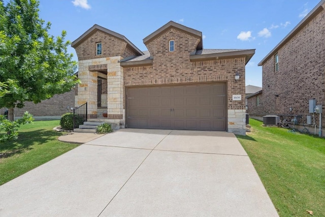 1608 Torre St, Leander, TX 78641 - french country inspired facade with brick siding, stone siding, a front lawn, and an attached garage