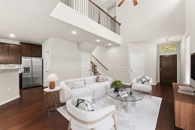 7709 Menchaca Rd Unit 5, Austin, TX 78745 - living area with stairs, dark wood-style flooring, ceiling fan, recessed lighting, and a towering ceiling