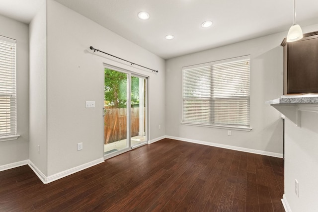 7709 Menchaca Rd Unit 5, Austin, TX 78745 - unfurnished dining area with dark wood-style flooring and recessed lighting