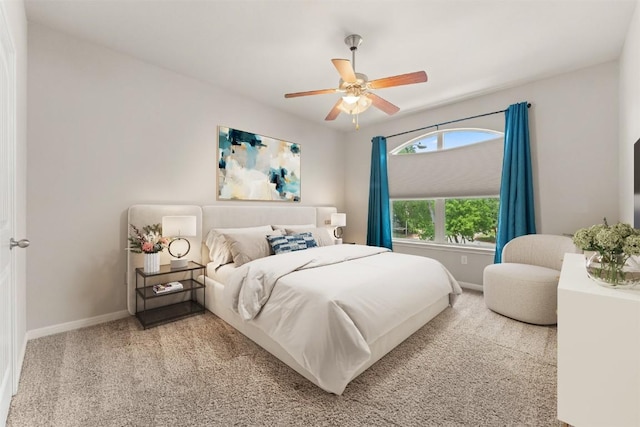 7709 Menchaca Rd Unit 5, Austin, TX 78745 - carpeted bedroom with baseboards and ceiling fan