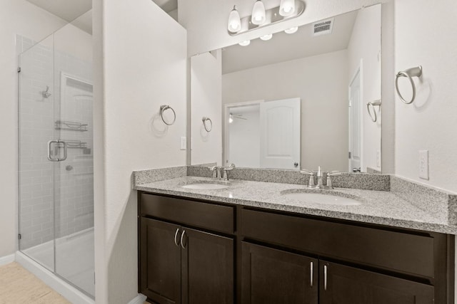 7709 Menchaca Rd Unit 5, Austin, TX 78745 - full bathroom featuring double vanity, a stall shower, and a ceiling fan
