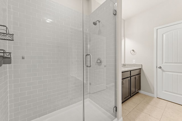 7709 Menchaca Rd Unit 5, Austin, TX 78745 - full bath featuring a shower stall, tile patterned flooring, and vanity