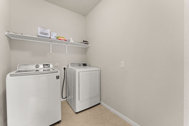 7709 Menchaca Rd Unit 5, Austin, TX 78745 - laundry area featuring independent washer and dryer and light tile patterned floors