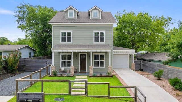 4605 Englewood Dr Unit A, Austin, TX 78745 - view of front of home featuring covered porch, a fenced front yard, roof with shingles, and a garage