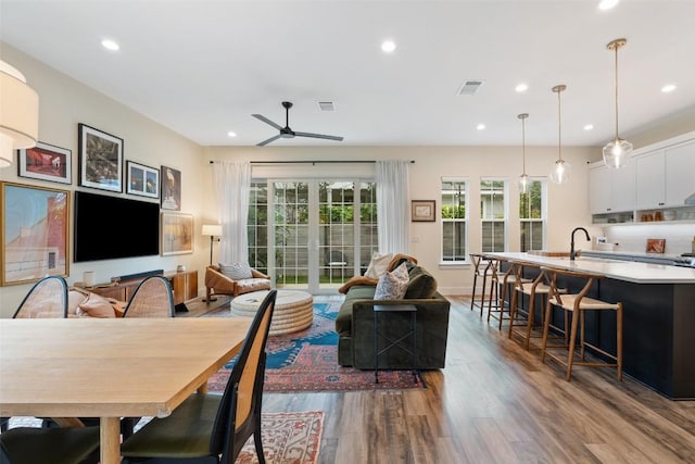 4605 Englewood Dr Unit A, Austin, TX 78745 - living area featuring wood finished floors, healthy amount of natural light, ceiling fan, and recessed lighting