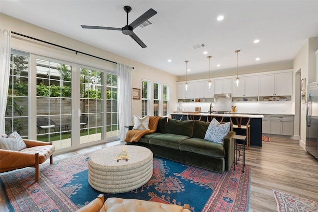 4605 Englewood Dr Unit A, Austin, TX 78745 - living room with ceiling fan, light wood-style floors, and recessed lighting
