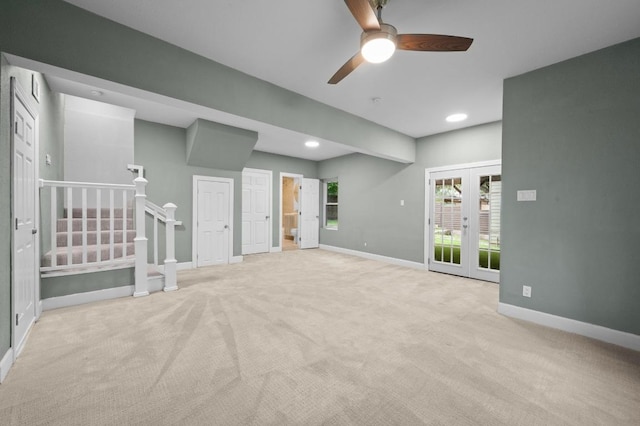 2109 W 10th St, Austin, TX 78703 - unfurnished living room featuring light colored carpet, french doors, ceiling fan, recessed lighting, and stairway